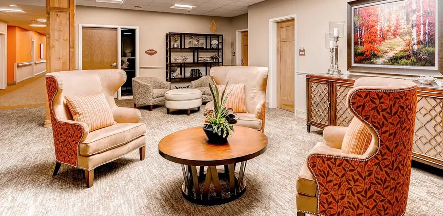 Cozy senior sitting area with warm tones and comfortable seating