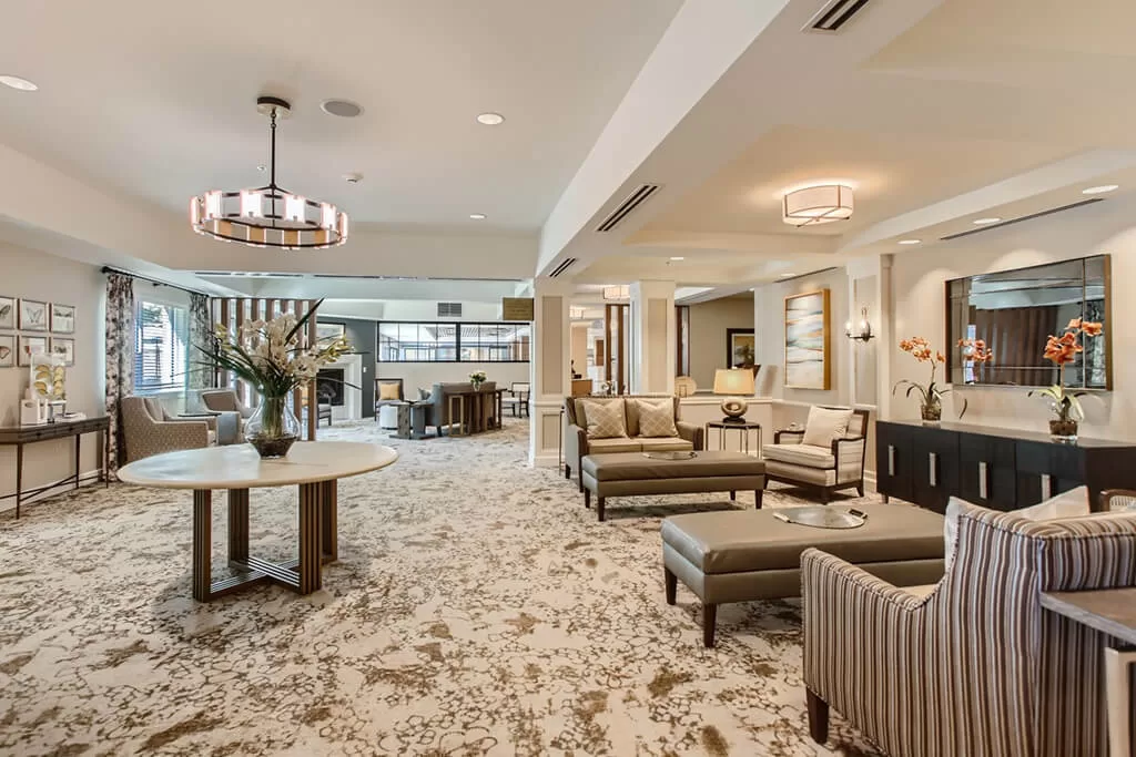 Spacious senior living lounge with cozy seating
