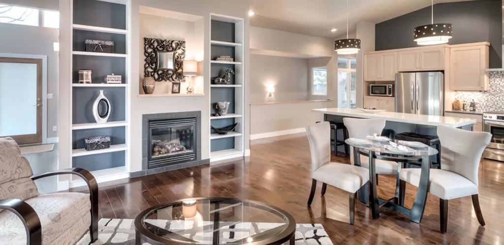 Elegant senior living space with fireplace and open-concept kitchen