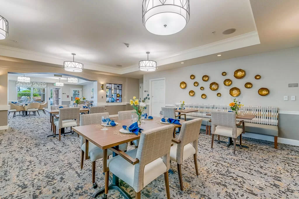 Elegant senior living dining room with warm lighting