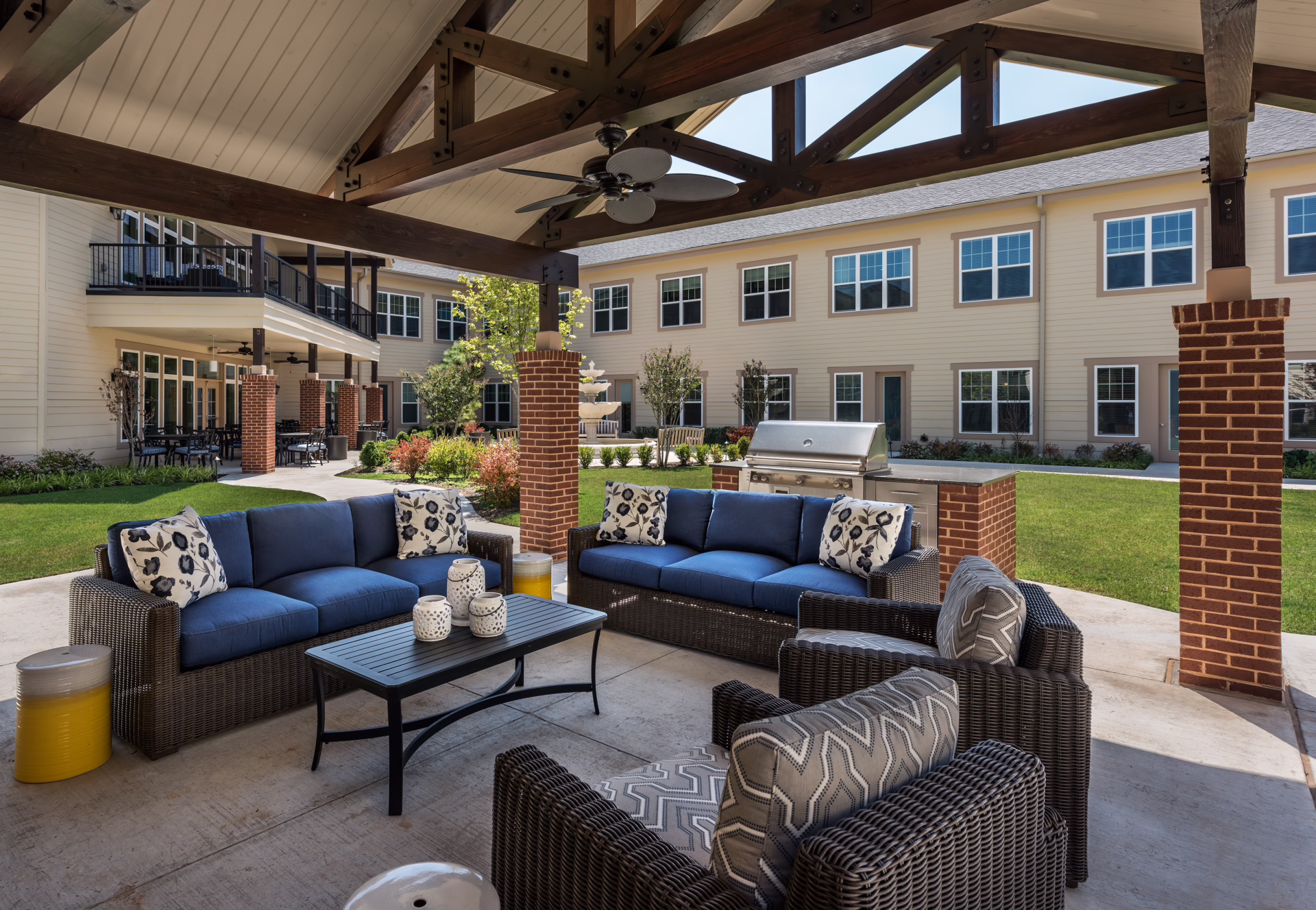 Senior living courtyard seating area designed for daily use, connecting residents to the outdoors, by Aneka Interiors